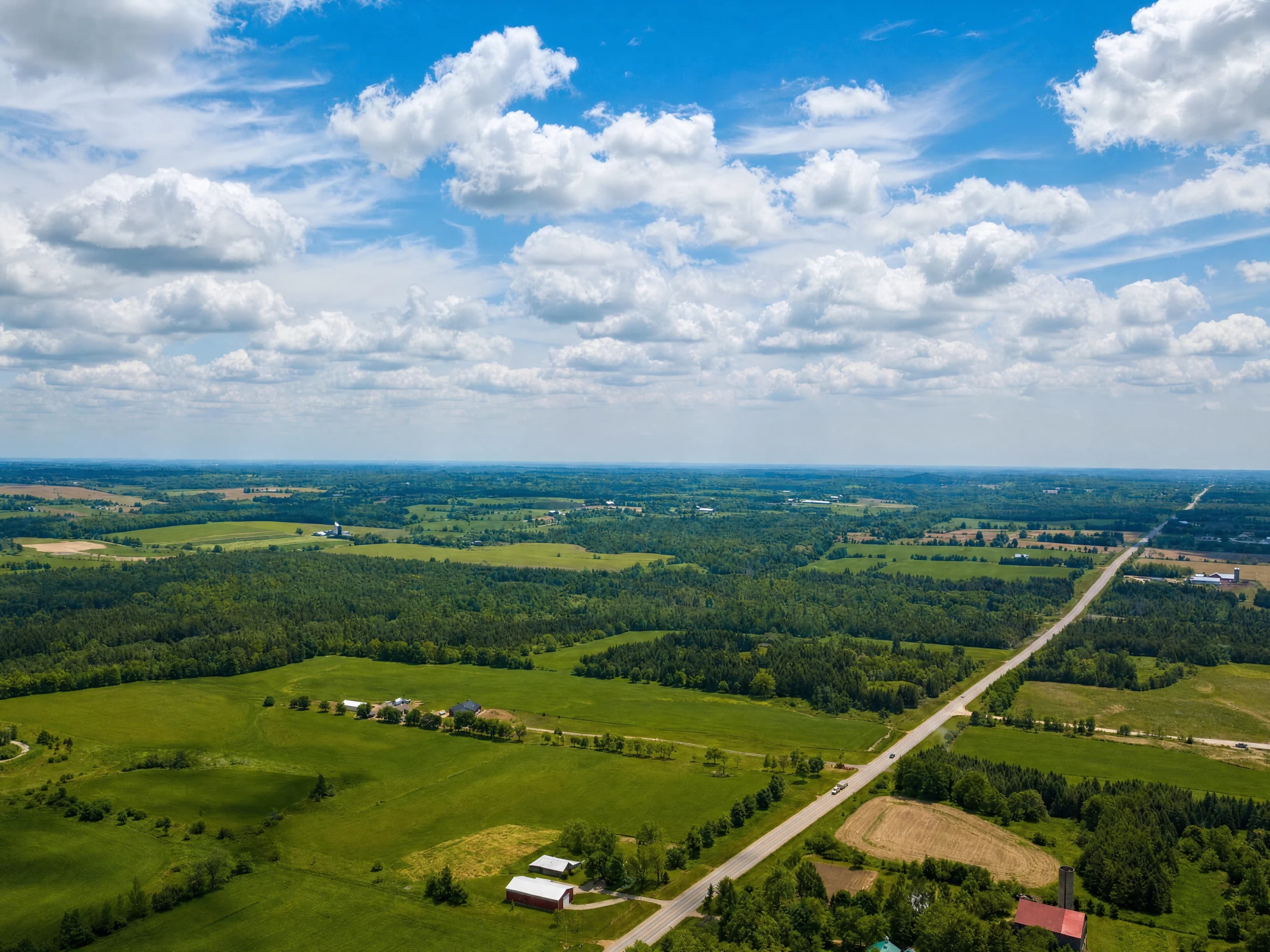 Enhanced aerial photograph of countryside and roads around Ospringe Highlands, based on the original community image