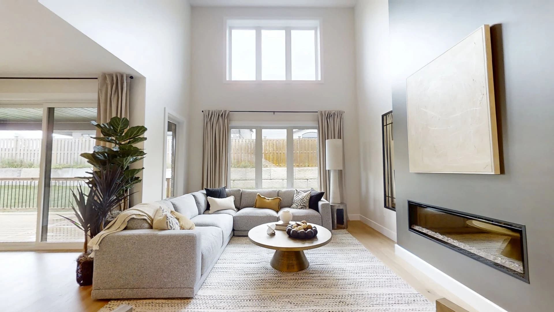 The Brentwood 3 model home's double-height living room, photographed in its published virtual tour